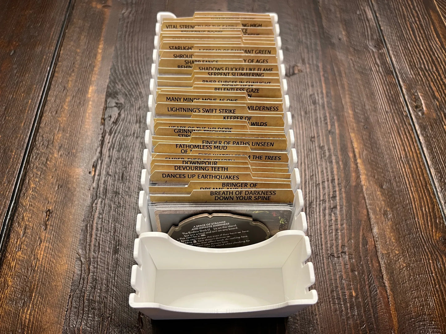 3D printed board game card organizer with labeled dividers on wooden table, KreativLayers product