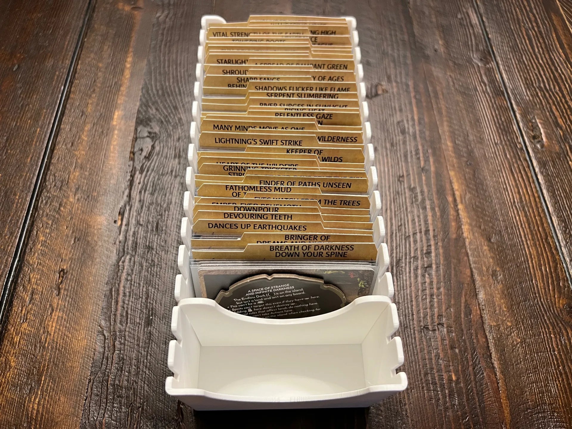 3D printed board game card organizer with labeled dividers on wooden table, KreativLayers product
