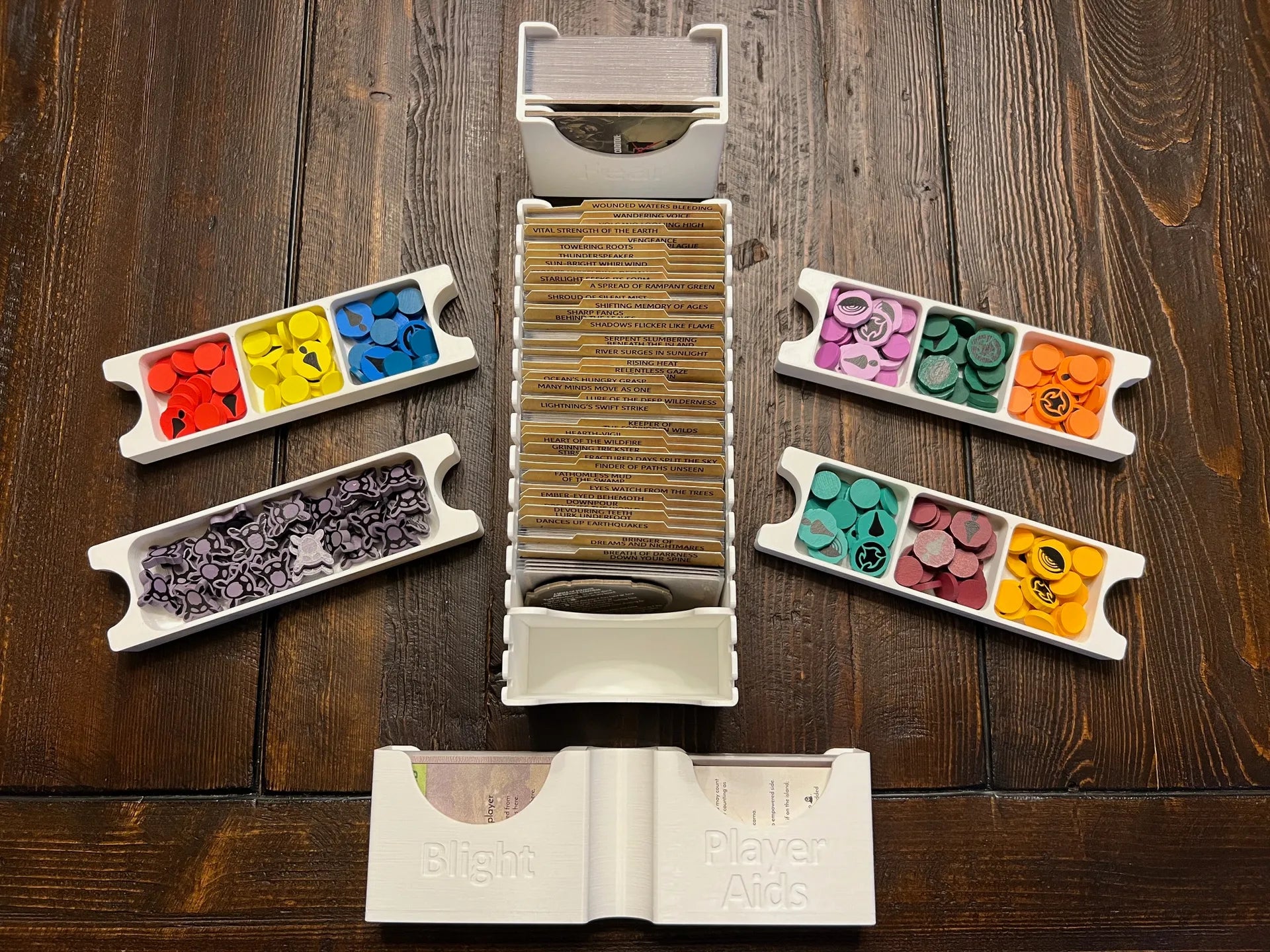 3D printed board game organizer with colorful game tokens and cards by KreativLayers